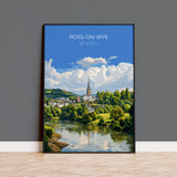 The image is a framed poster depicting a scenic view of Ross-on-Wye, a town in the Hebrides, Scotland. The poster features a church spire, a river, and lush greenery, creating a picturesque landscape.