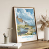 A framed poster of a coastal village in Kent, England, featuring a small boat on the shore and a cloudy sky in the background.