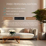 The image is a living room with a sofa, a coffee table, and a potted plant. The sofa has a vase of white roses on it. The room has a neutral color scheme with a wooden floor and a large window. The image does not contain any text, and there are no specific actions or objects described.
