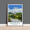 The image is a framed poster depicting a scenic view of Ross-on-Wye, a town in Herefordshire, England. The poster showcases a picturesque landscape with a river, lush greenery, and a church spire in the distance. The text "ROSS-ON-WYE" and "HEREFORDSHIRE" is prominently displayed, indicating the location of the scene.
